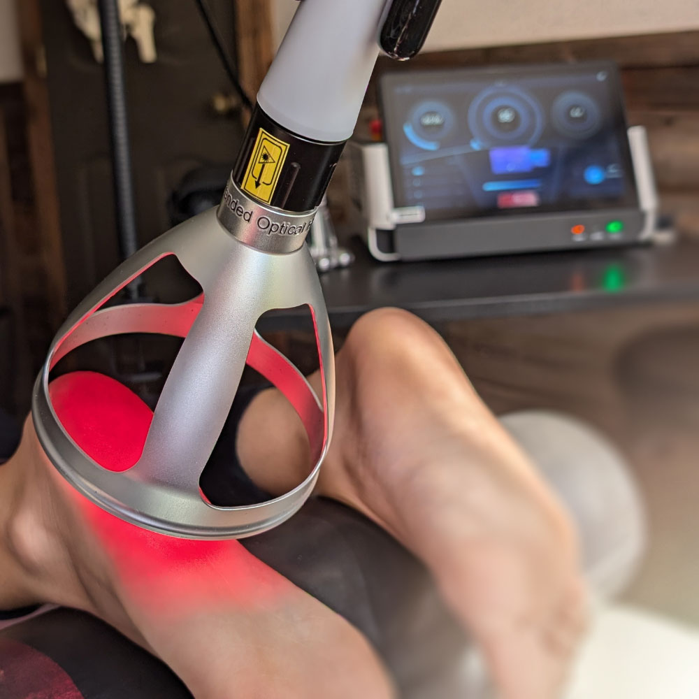 Laser therapy session using Medray Supermax on knee.